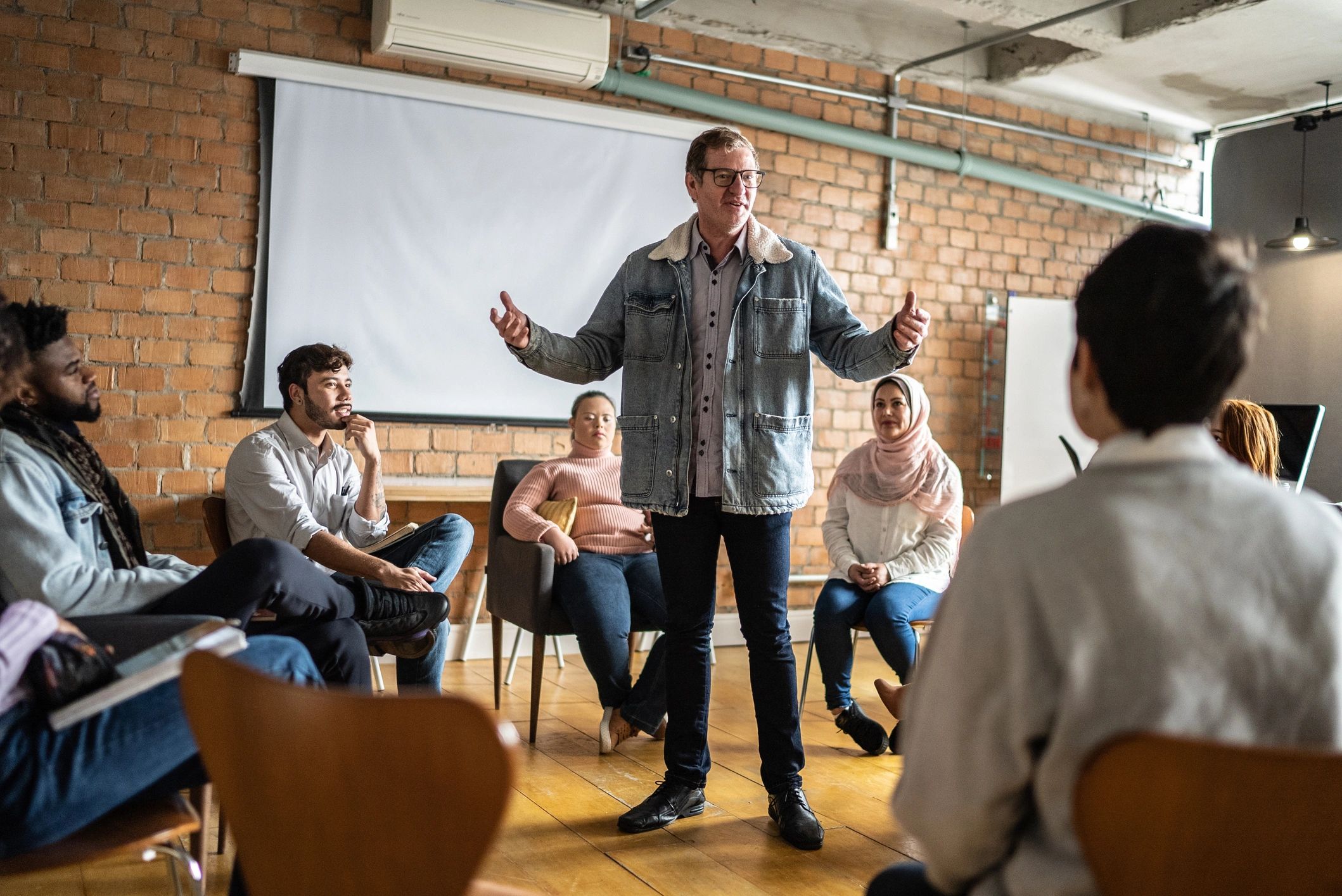 Instructor leading a lecture for adult mental health professionals