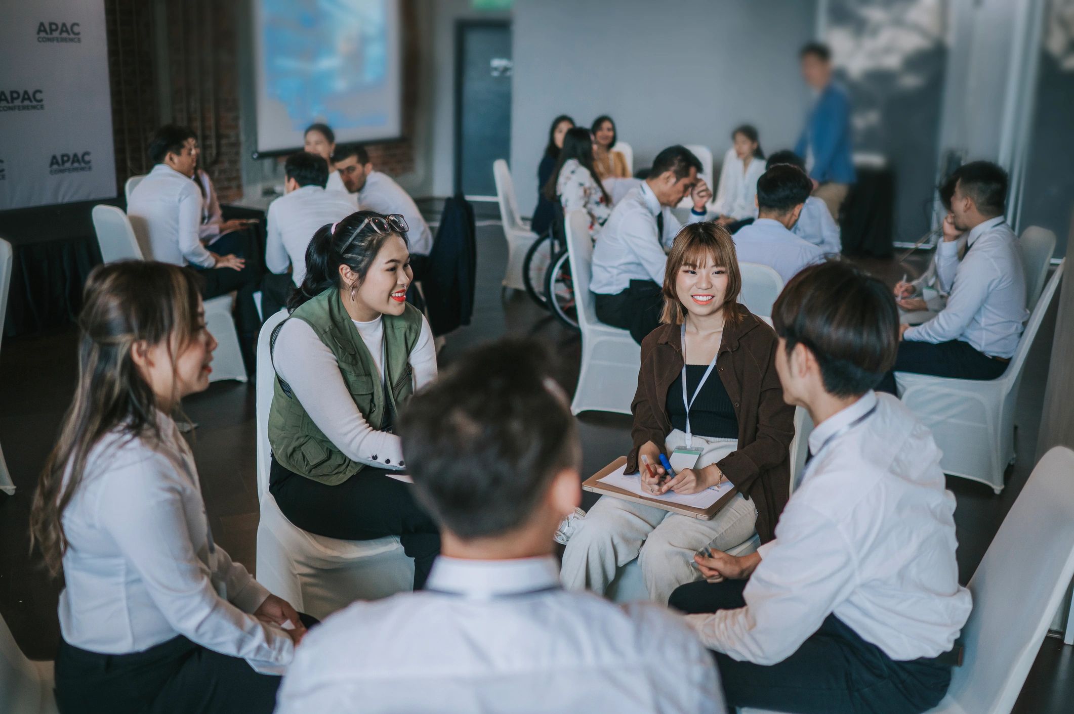 Small group workshop participants collaborating during a professional training session