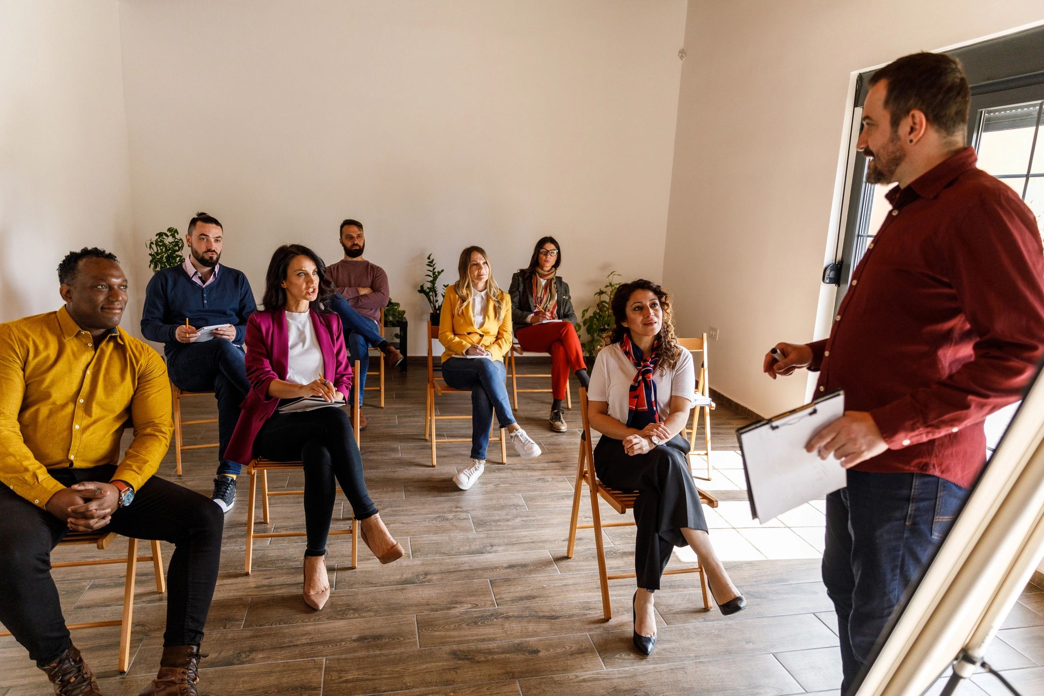 Professional trainer leading a workshop for adult learners